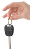 Hand holding car keys